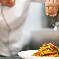 sprinkling seasonings from high up. - food stock pictures, royalty-free photos & images