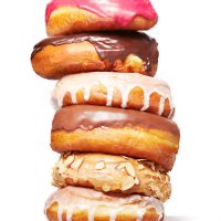 stack of doughnuts - junk food stock pictures, royalty-free photos & images