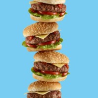 stack of hamburgers - junk food stockfoto's en -beelden