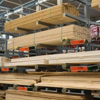 stacked wooden planks arranged on shelves in hardware store warehouse - home decoration stock pictures, royalty-free photos & images