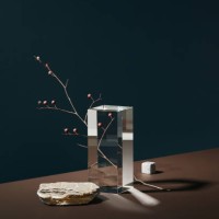 stage with empty natural podium made of white stones, glass prism and tree branch on dark blue and chocolate brown background. eco podium mock up with copy space. - home decoration stockfoto's en -beelden