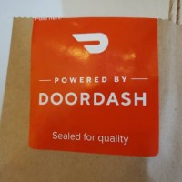 Sticker on takeout bag reading Powered by Doordash, Sealed for Quality, San Ramon, California, June 11, 2020.