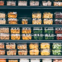store shelves with dried fruit, veggies, and nuts in a non-ecological packaging - food stock pictures, royalty-free photos & images