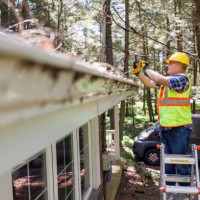 storm damage and photo fixation after storm: engineer in protective wear photographing collapsed house roof. focus on inspector - home decoration stock pictures, royalty-free photos & images