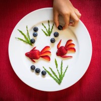 strawberries in shape of fish food creation, flat lay - food stock pictures, royalty-free photos & images