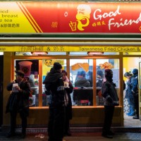 Street scene in Chinatown outside and looking in to a Taiwanese fried chicken and bubble tea take away estaurant on 17th January 2024 in London,...