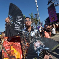 Street vendor offers merchandise of Madonna before a massive free show to close 