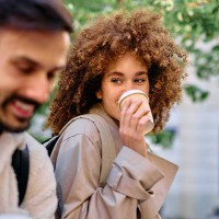 students drinking coffee and smiling during a break between classes - junk food stock pictures, royalty-free photos & images