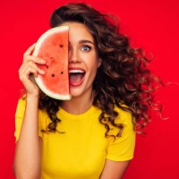 studio portrait of a beautiful girl with watermelon - food stock pictures, royalty-free photos & images
