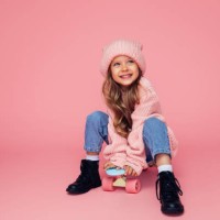 studio portrait of a cute girl with skateboard - fashion stock pictures, royalty-free photos & images