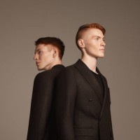 studio portrait of twins - fashion stock pictures, royalty-free photos & images