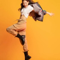 studio shot of fashionable young woman dancing - fashion stock pictures, royalty-free photos & images