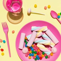 studio shot of glass of water and plastic plate filled with various sweets - junk food stock pictures, royalty-free photos & images