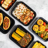 studio shot of variety of take out food including chop suey, stuffed potatoes, fajitas, rice muffins, ricotta rolls, various salads and terrine - junk food stock pictures, royalty-free photos & images