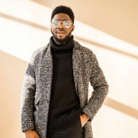 stylish african american man in glasses posing at camera - fashion stock pictures, royalty-free photos & images