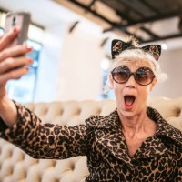 stylish and quirky senior woman at restaurant - fashion stock pictures, royalty-free photos & images
