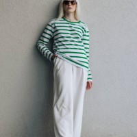 stylish fashion model in sunglasses against a white wall posing in modern trendy clothes - fashion stock pictures, royalty-free photos & images