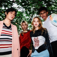 stylish group portrait featuring bold colors and creative fashion statements, capturing individuality and group synergy in a vibrant outdoor environment. - fashion stock pictures, royalty-free photos & images