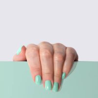 stylish trendy mint green color manicure on gray and mint background. - nails art stock pictures, royalty-free photos & images