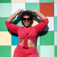 stylish woman looking excited against multicolored tiled wall - home decoration stock pictures, royalty-free photos & images