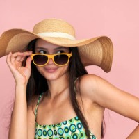 stylish woman posing with sun hat and sunglasses - fashion stock pictures, royalty-free photos & images