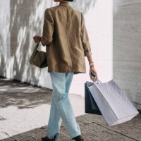 stylish woman walking outdoors with shopping bags - fashion stock pictures, royalty-free photos & images