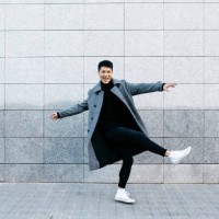 stylish young man dancing on the street - fashion stock pictures, royalty-free photos & images