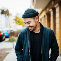 stylish young man laughing in city street - fashion stock pictures, royalty-free photos & images