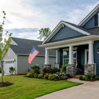 suburban patriotic homes and neighborhoods and the celebration of independence day - garden decoration stock pictures, royalty-free photos & images