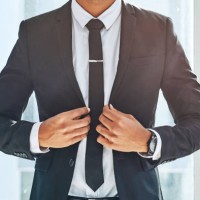success matches perfectly with a stylish suit - fashion stock pictures, royalty-free photos & images