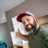 successful installing and leveling shelves in the apartment using the professional laser level - home decoration stock pictures, royalty-free photos & images