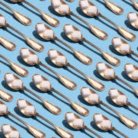 sugar cubes in metallic spoons on the blue background - junk food stock pictures, royalty-free photos & images