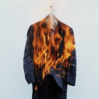 suit on hanger burning - fashion stock pictures, royalty-free photos & images