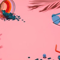 summer flat lay - tropical palm shadows, heart shaped sunglasses and cocktail glass filled with confetti on soft pink background - fashion stock pictures, royalty-free photos & images