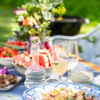 summer outdoor table setting with salad, food and flowers - garden decoration stock pictures, royalty-free photos & images