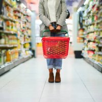 supermarket aisle, woman legs and basket for shopping in grocery store. customer, organic grocery shopping and healthy food on groceries sale shelf or eco friendly retail purchase in health shop - food stock pictures, royalty