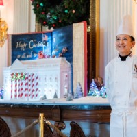 Susan Morrison, White House Executive Pastry Chef, stands with The Gingerbread White House in the State Dining Room during the media preview of the...