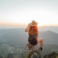switzerland, grosser mythen, young woman on a hiking trip sitting on a rock at sunrise - travel stock pictures, royalty-free photos & images