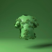 t shirt covered with green plants against green background - fashion stock pictures, royalty-free photos & images