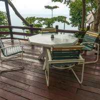 table and chair at outdoor restaurant facing to ocean - garden decoration stock pictures, royalty-free photos & images