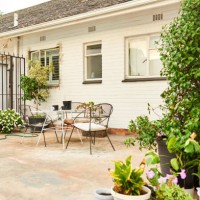 table and chairs sitting outside on the patio of a home - garden decoration stock pictures, royalty-free photos & images
