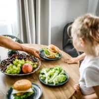 table setting with love: a family coming together for a meal at home. - junk food stock pictures, royalty-free photos & images