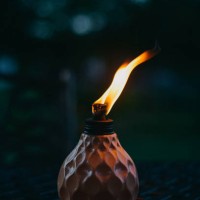 table torch insect repellant lit at night - garden decoration stock pictures, royalty-free photos & images