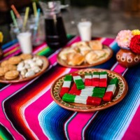table with decorations, food and a sugar skull piñata for day of the dead - garden decoration stock pictures, royalty-free photos & images