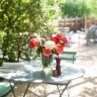 table with roses in a garden - garden decoration stock pictures, royalty-free photos & images