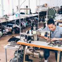 tailor and worker in chinese clothes factory - fashion stock pictures, royalty-free photos & images