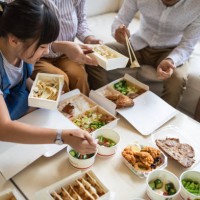 taiwanese family eating chinese take out food at home - junk food stock pictures, royalty-free photos & images