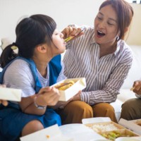 taiwanese family enjoying lunch time together at home - junk food stock pictures, royalty-free photos & images