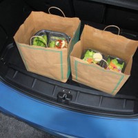 take-out food in trunk of car using curbside pick-up - junk food stock pictures, royalty-free photos & images