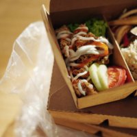 take away asian food in recycled paper container on dining table - junk food stock pictures, royalty-free photos & images